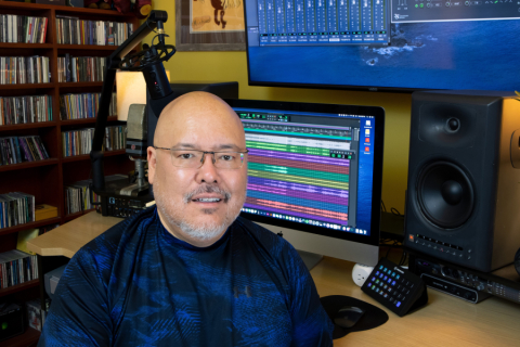 Man in glasses in home sound studio