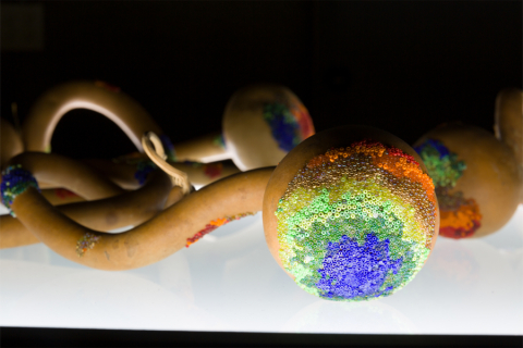 Sarah Rosalena, "CMB RGB", 2021; Glass beads, gourds, pine sap, beeswax, Cosmic Microwave Background